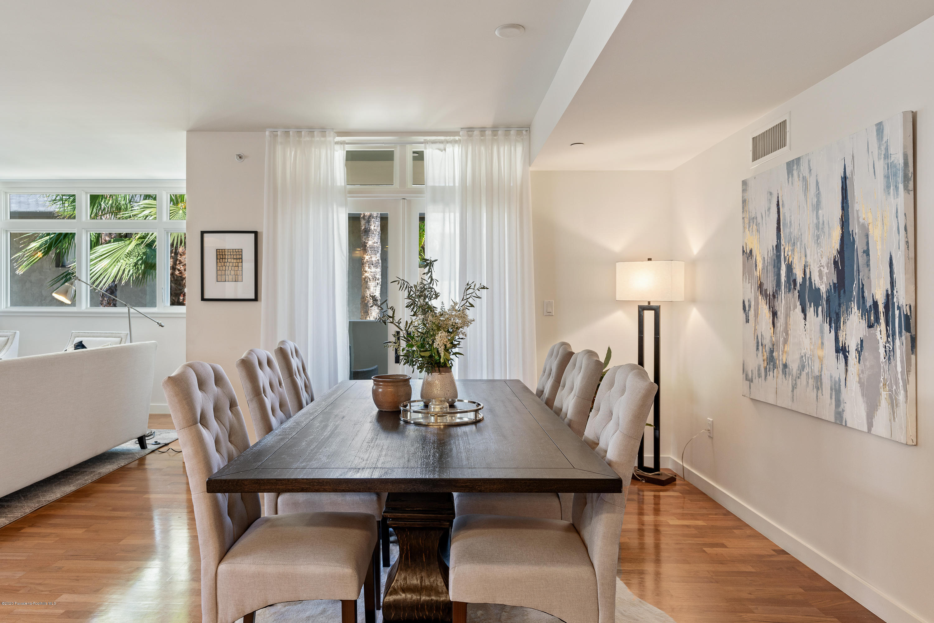 920 Granite Drive, Unit 309 Pasadena, CA 91101 - Photo 7 of 40 a view of a dining room with furniture and wooden floor