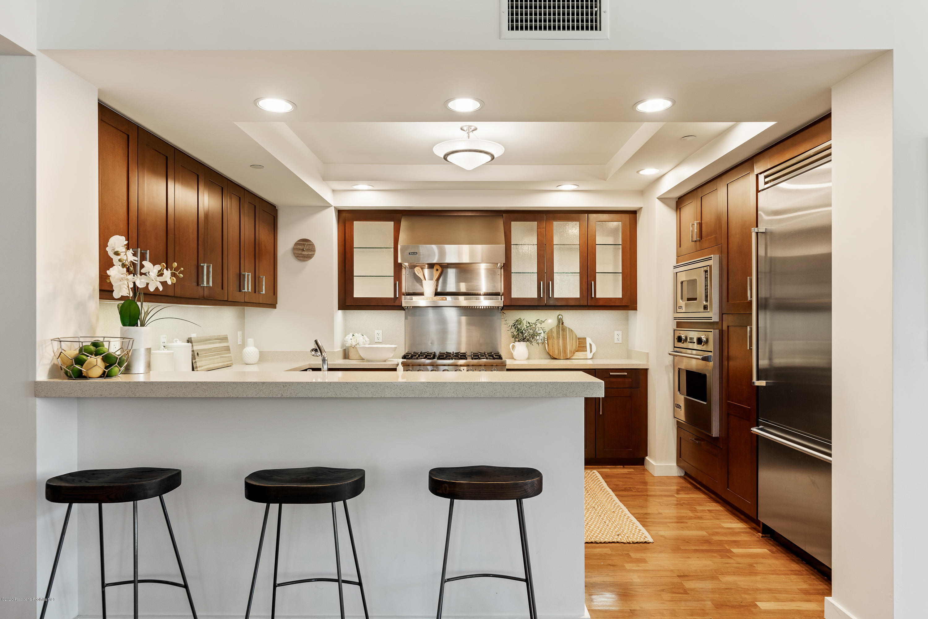 920 Granite Drive, Unit 309 Pasadena, CA 91101 - Photo 10 of 40 a kitchen with stainless steel appliances granite countertop a sink and cabinets