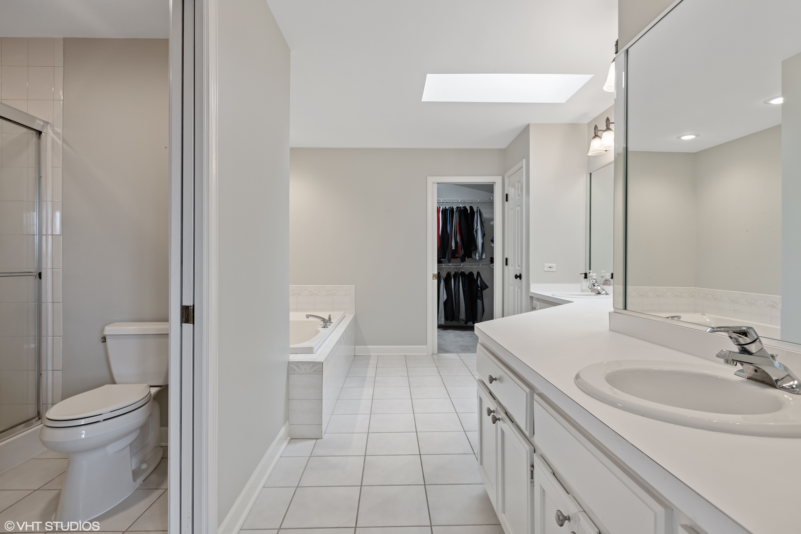 1909 Cornell Drive New Lenox, IL 60451 - Photo 16 of 26 a bathroom with a sink a toilet and a large mirror