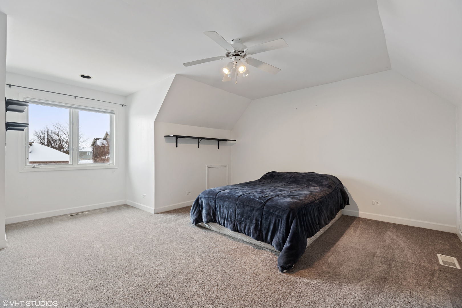 1909 Cornell Drive New Lenox, IL 60451 - Photo 17 of 26 a living room with a couch and a ceiling fan