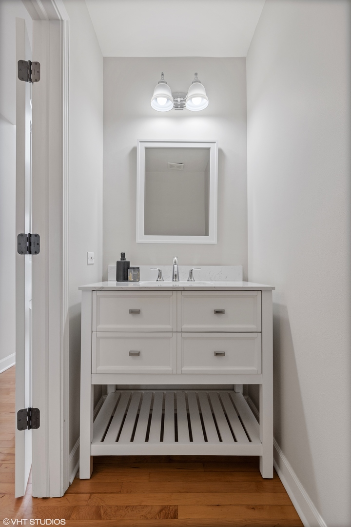 1909 Cornell Drive New Lenox, IL 60451 - Photo 18 of 26 a bathroom with a sink and a mirror