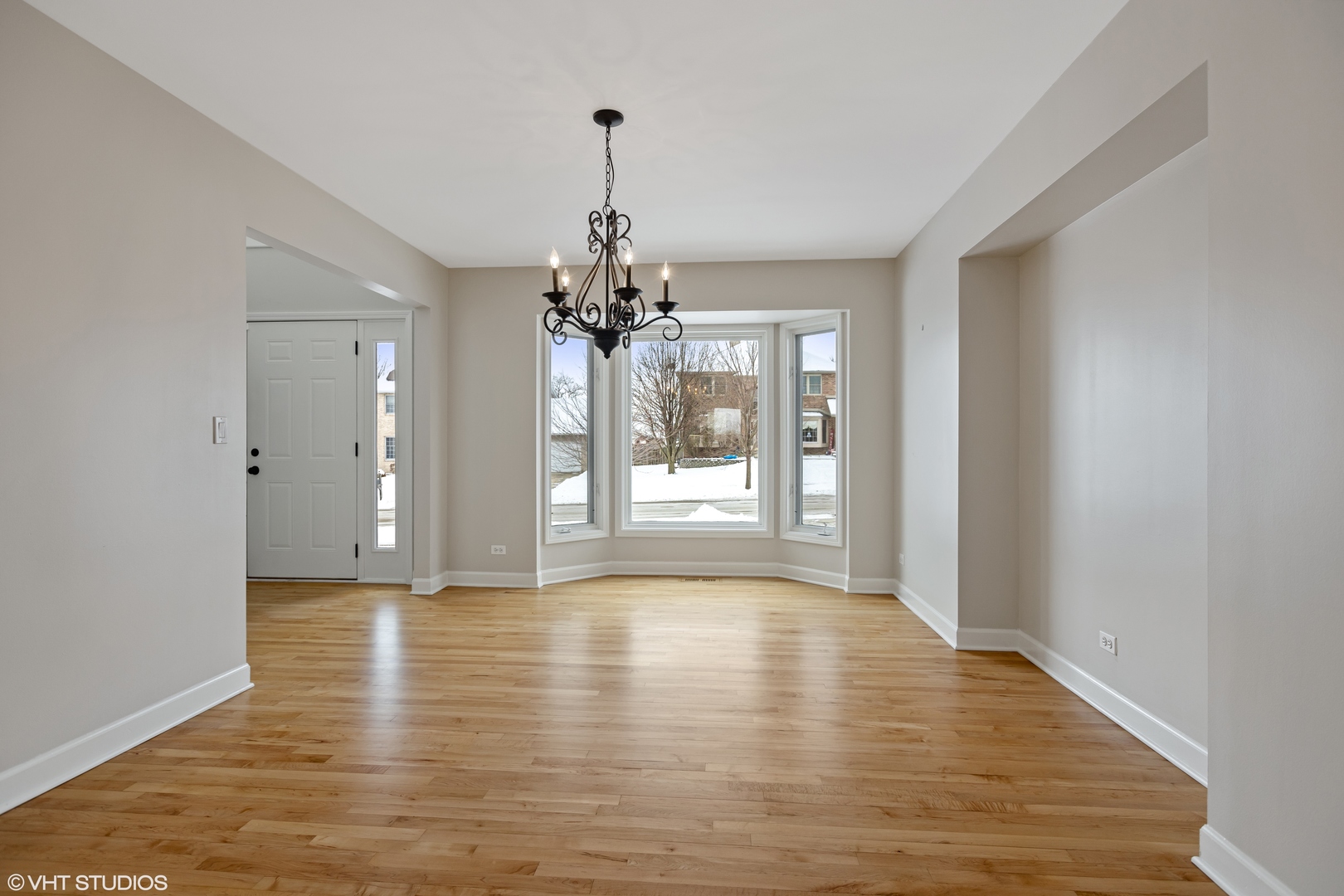 1909 Cornell Drive New Lenox, IL 60451 - Photo 3 of 26 a view of an empty room with wooden floor and a window