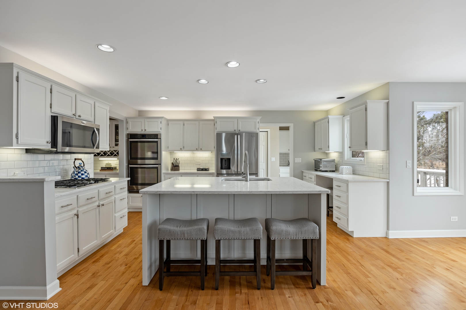 1909 Cornell Drive New Lenox, IL 60451 - Photo 6 of 26 a large white kitchen with cabinets chairs and wooden floor