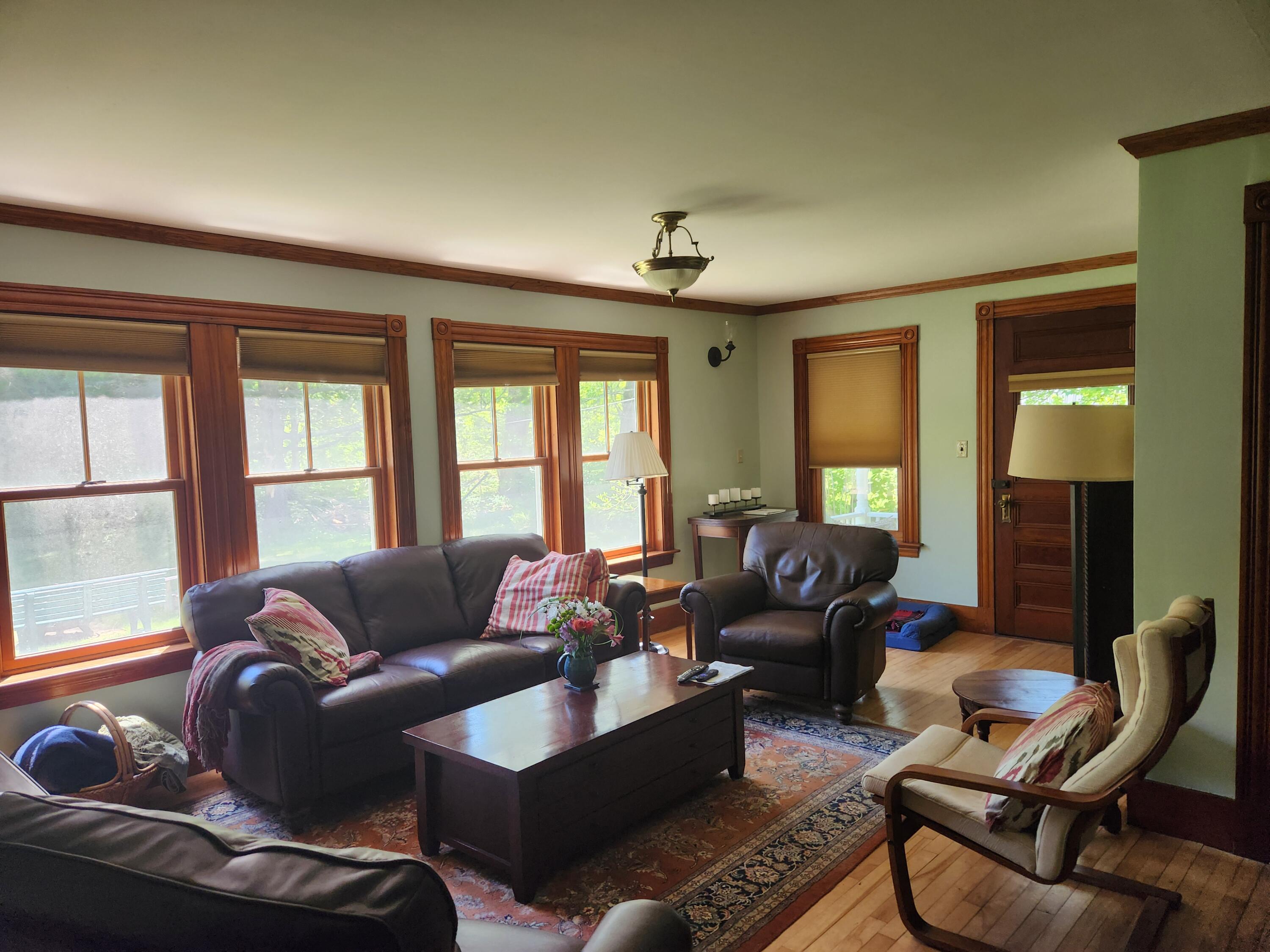 286 Staples Hill Road Canton, ME 04221 - Photo 21 of 118 Living room with hearth and back porch