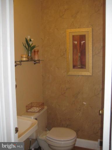 7906 Woodyard Road Clinton, MD 20735 - Photo 7 of 21 Main floor half bath