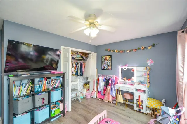 a living room with lots of furniture and a flat screen tv