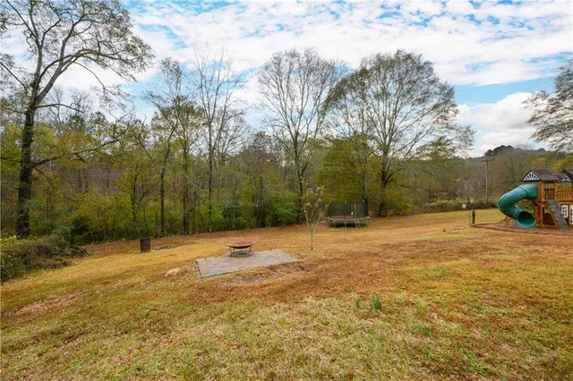 a backyard of a house with lots of green space
