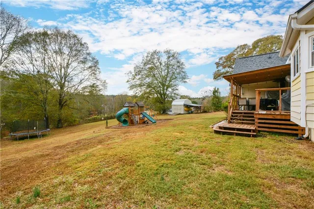 a view of a swimming pool with a patio