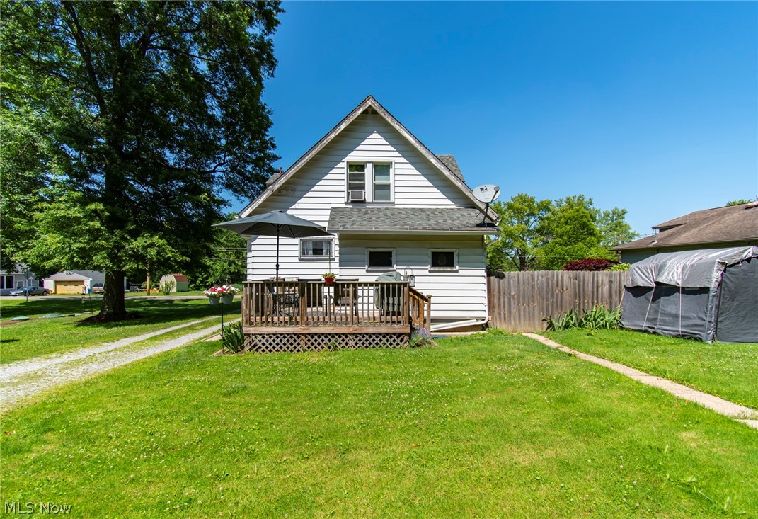 1690 Salt Springs Road Mineral Ridge, OH 44440 - Photo 21 of 21 Back of house featuring a deck and a lawn