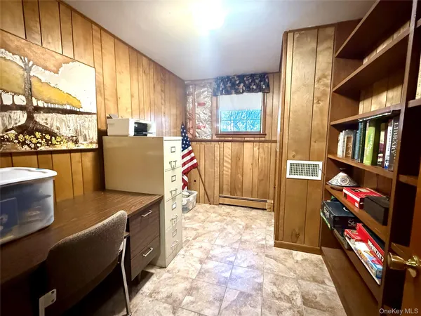 a view of a livingroom with furniture and a window