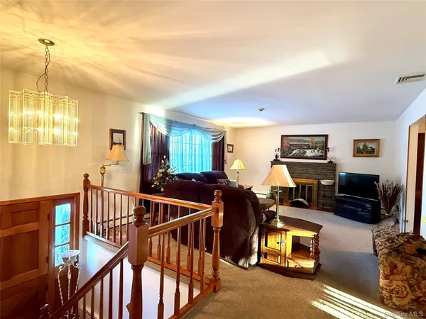 a view of a livingroom with furniture and windows