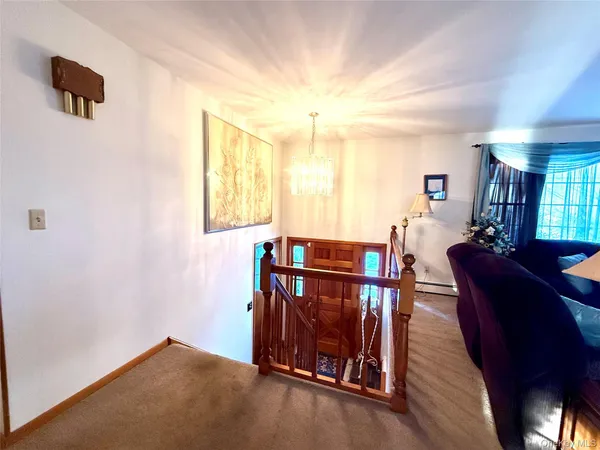 a view of a livingroom with furniture and windows