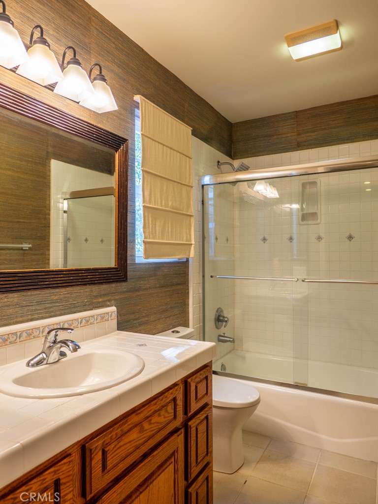 1934 Pasadena Glen Road Pasadena, CA 91107 - Photo 19 of 38 a bathroom with a sink and a mirror
