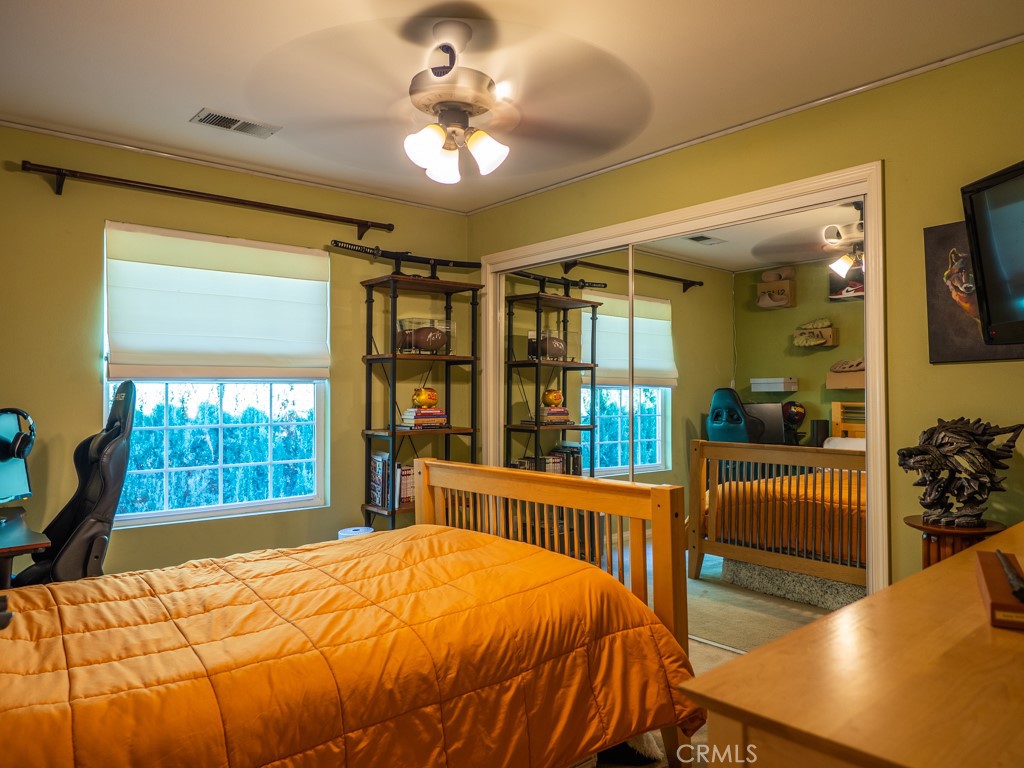 1934 Pasadena Glen Road Pasadena, CA 91107 - Photo 20 of 38 a bedroom with a bed and large windows with outer view