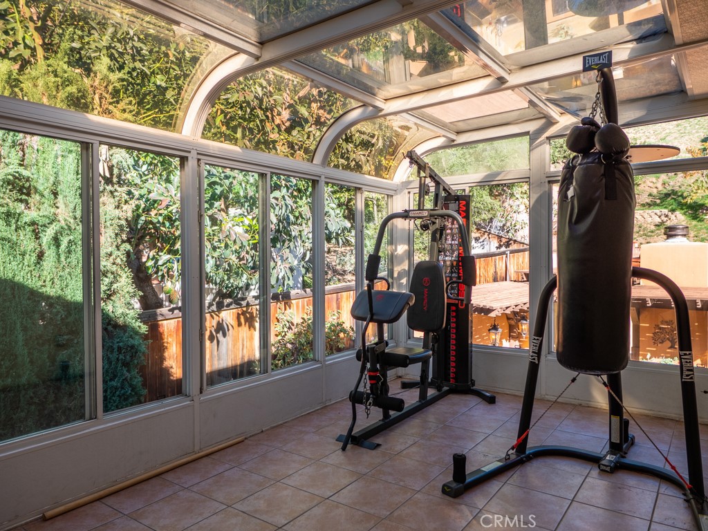 1934 Pasadena Glen Road Pasadena, CA 91107 - Photo 22 of 38 a view of a room with gym equipment and large windows