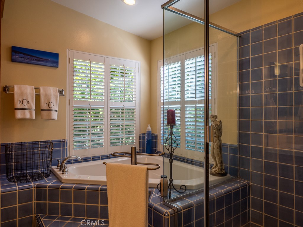 1934 Pasadena Glen Road Pasadena, CA 91107 - Photo 27 of 38 a bathroom with a granite countertop sink a toilet and shower