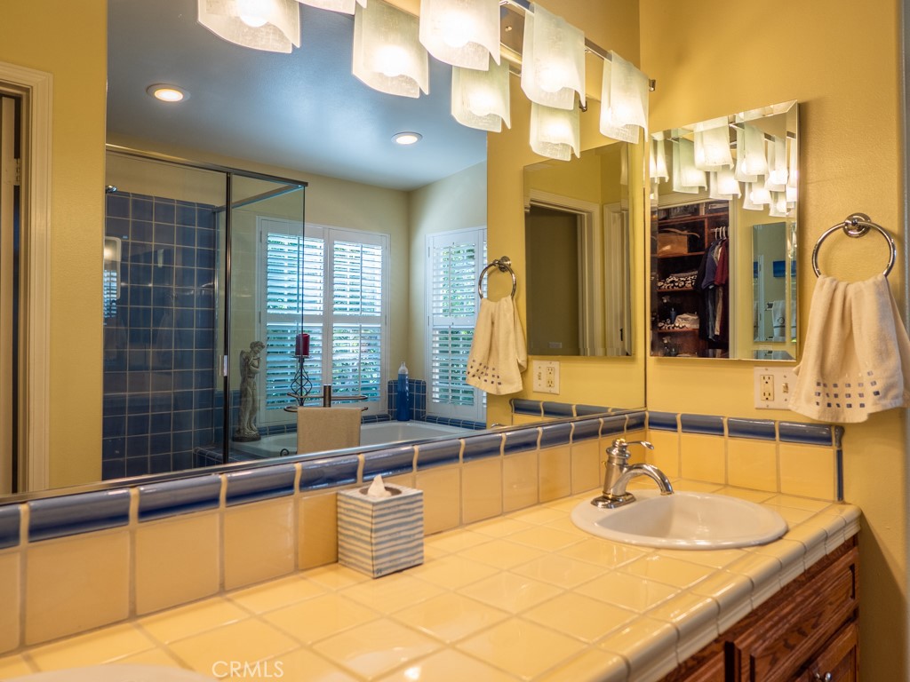 1934 Pasadena Glen Road Pasadena, CA 91107 - Photo 28 of 38 a bathroom with a granite countertop sink and a mirror