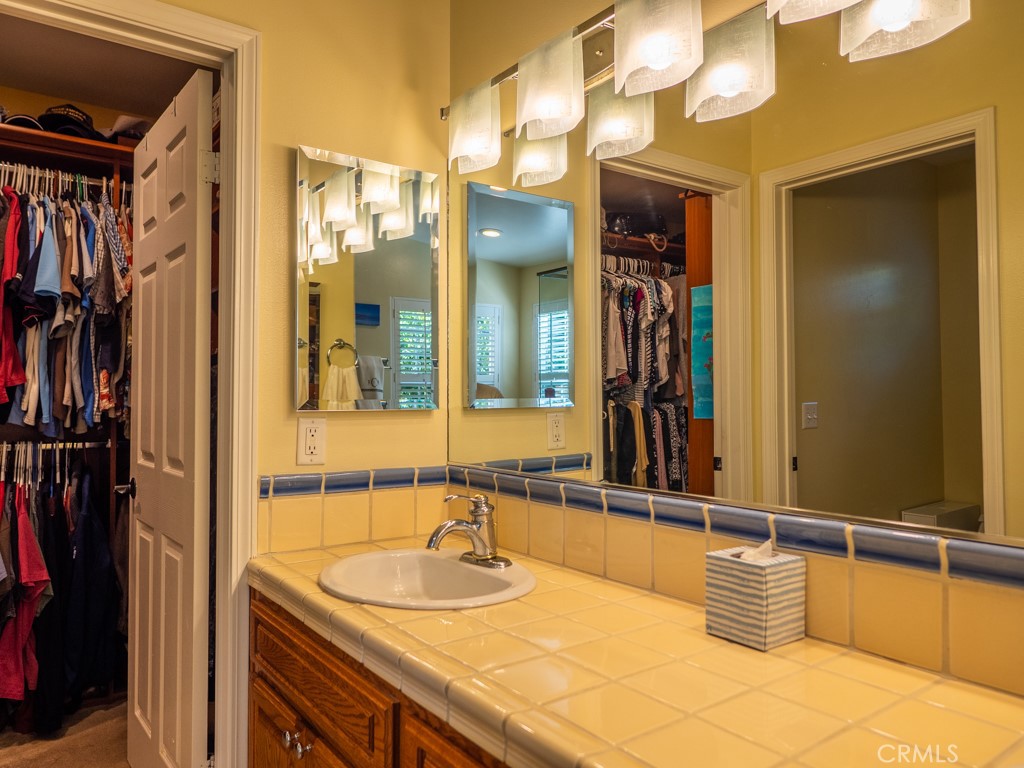 1934 Pasadena Glen Road Pasadena, CA 91107 - Photo 29 of 38 a bathroom with a sink and a mirror