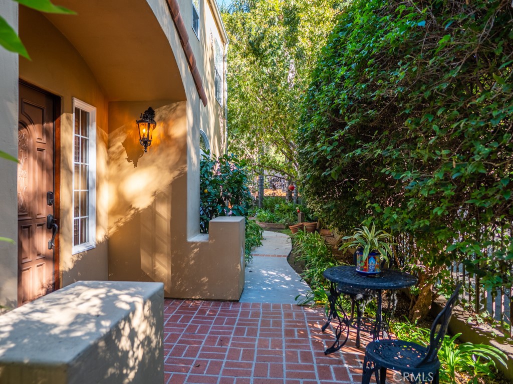 1934 Pasadena Glen Road Pasadena, CA 91107 - Photo 5 of 38 a view of a patio with table and chairs and potted plants
