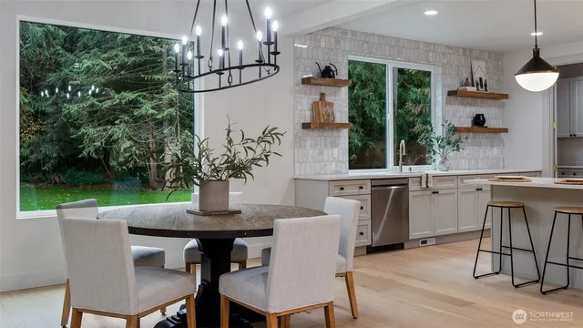a bath tub sitting in a bathroom next to a window