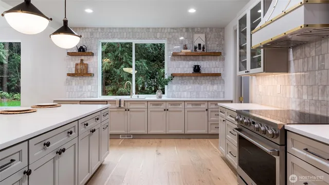 a utility room with sink dryer and washer