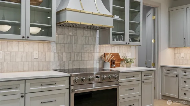 an aerial view of a house with large trees and plants