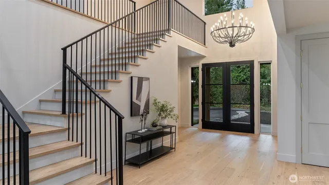 a living room with furniture potted plant a fireplace and a window