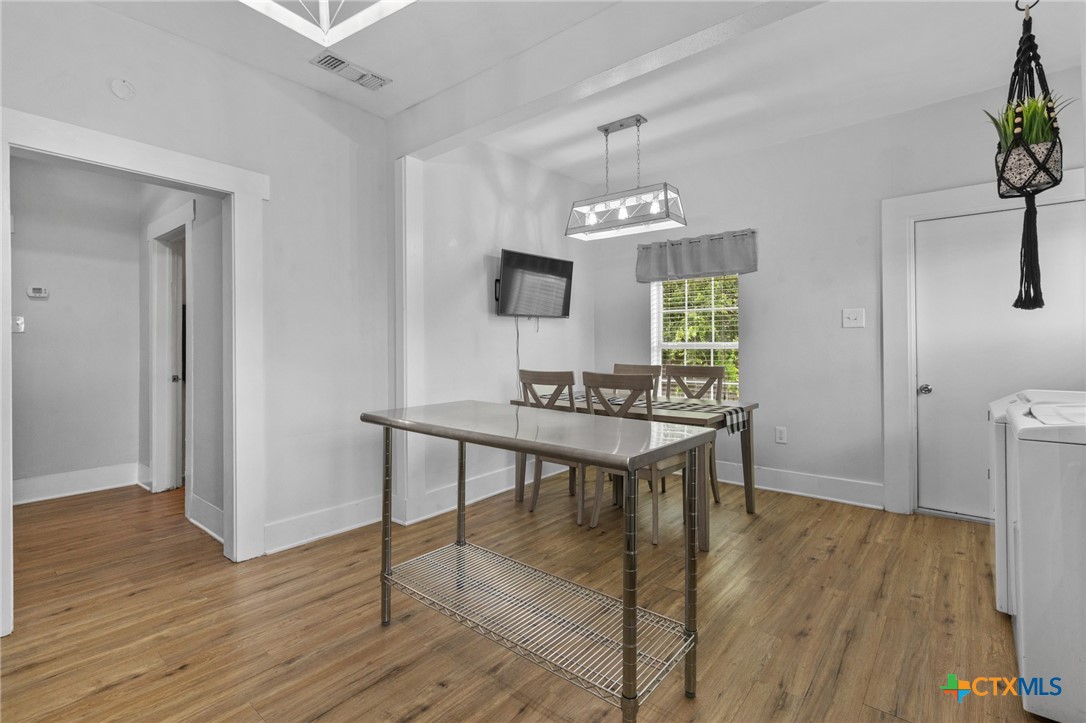 905 North Navarro Street Victoria, TX 77901 - Photo 21 of 28 a view of a livingroom with furniture and wooden floor