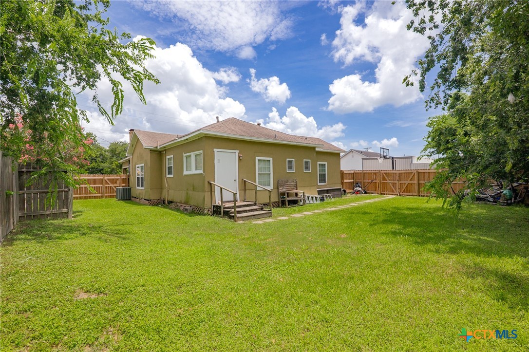 905 North Navarro Street Victoria, TX 77901 - Photo 25 of 28 a view of a house with a back yard