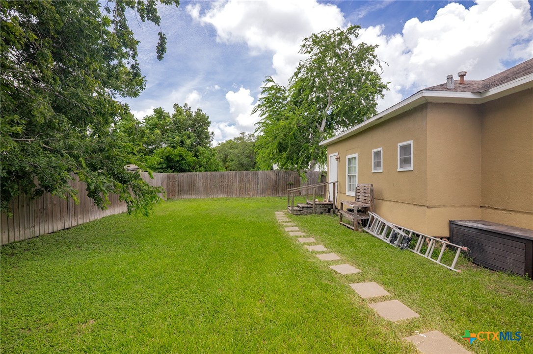 905 North Navarro Street Victoria, TX 77901 - Photo 28 of 28 a view of backyard of house with green space