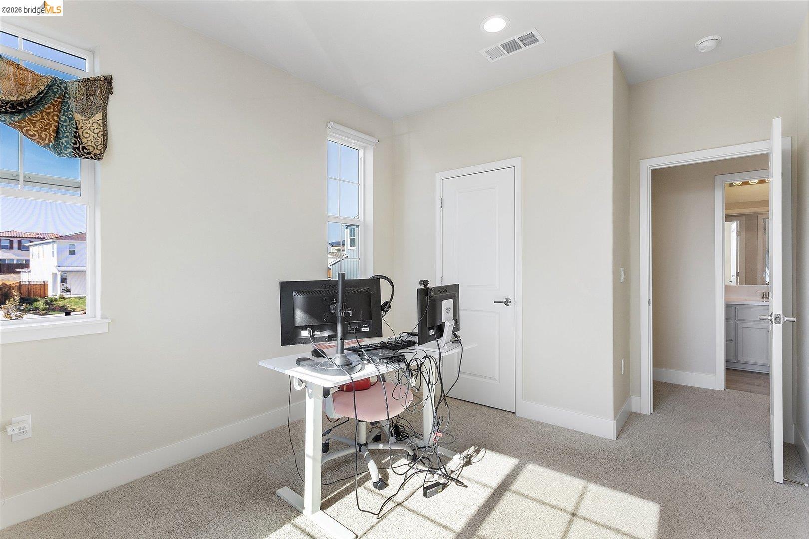 5601 Ridgepoint Way Antioch, CA 94531 - Photo 34 of 59 Carpeted room with two windows, recessed lighting, and a white paneled door