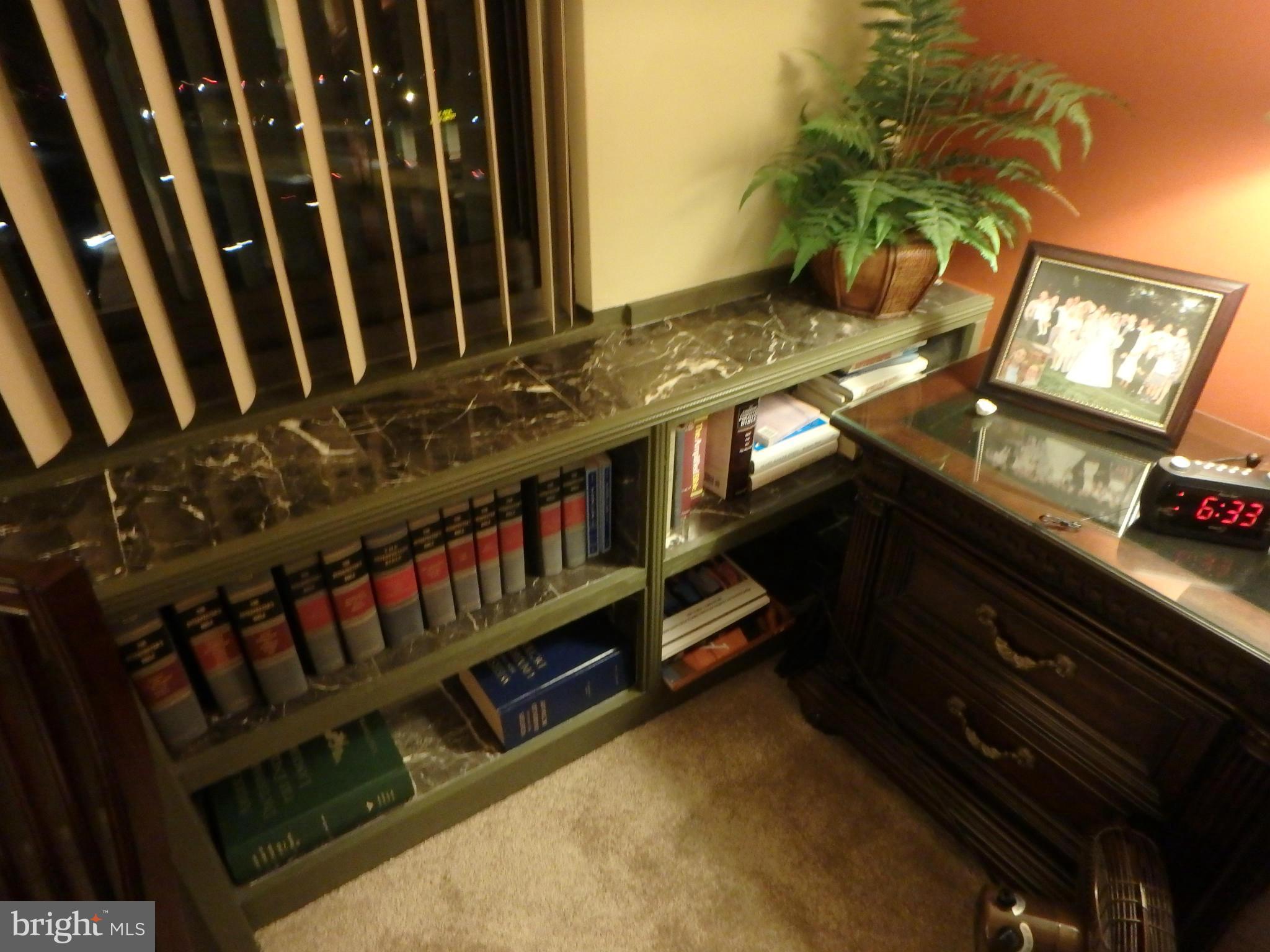1011 Arlington Boulevard, Unit 627 Arlington, VA 22209 - Photo 13 of 28 BUILT-IN BOOK CASES W/ MARBLE ACCENTS