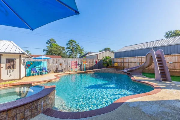 swimming pool view with a outdoor seating