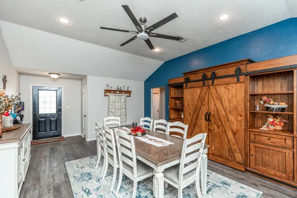 a dining room with furniture and window