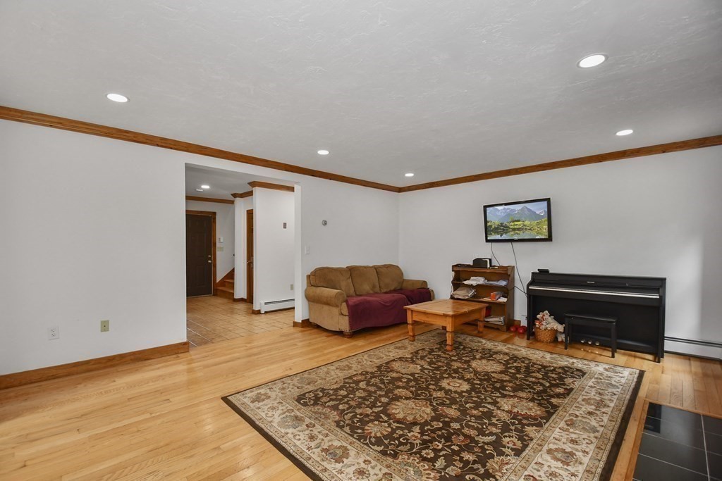 73 Old County Road Ashburnham, MA 01430 - Photo 17 of 38 a living room with furniture and a rug