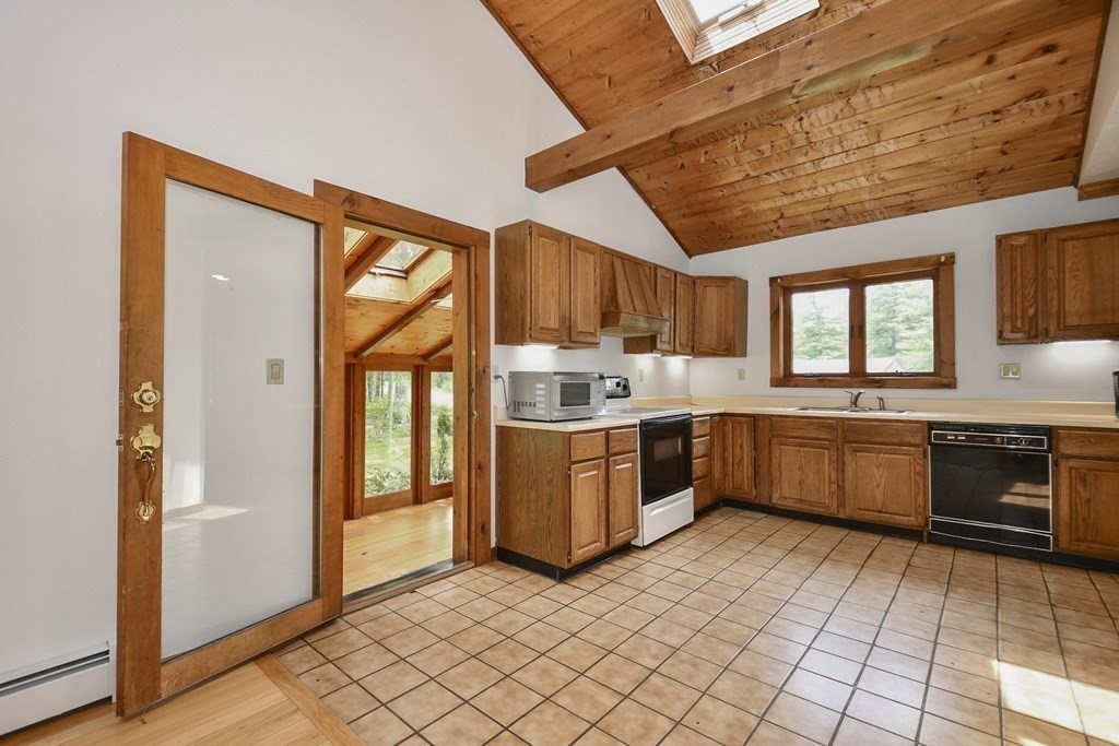 73 Old County Road Ashburnham, MA 01430 - Photo 8 of 38 a kitchen with a stove a sink and a refrigerator