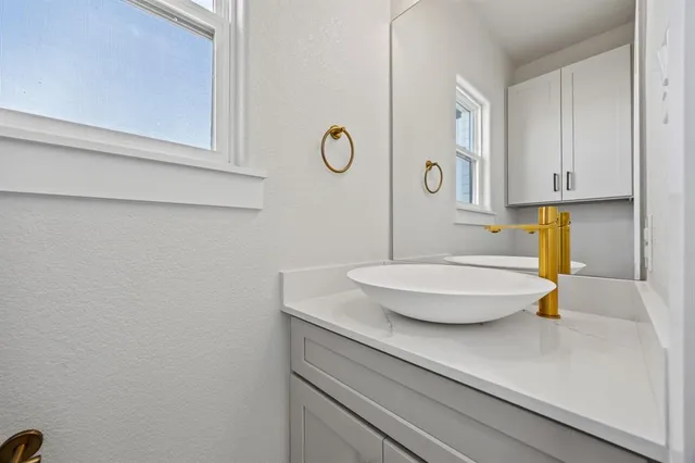 a bathroom with a sink and a mirror