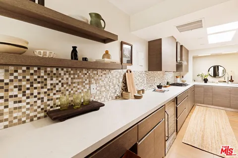 a kitchen with a sink and a stove