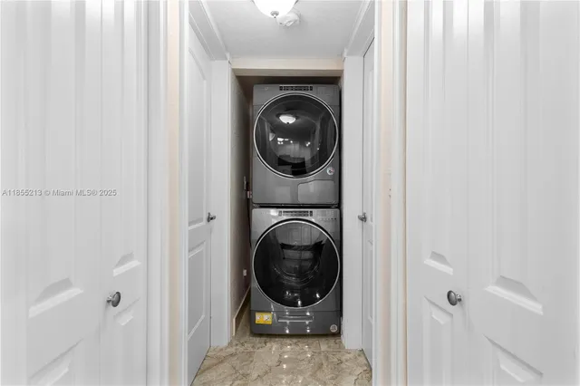 a view of a hallway with washer and dryer