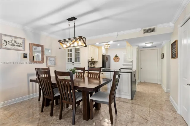 a view of a dining room and chandelier