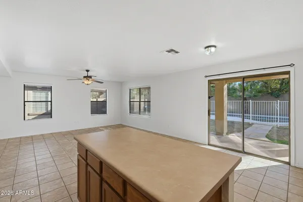 a kitchen that has a sink and a stove top oven