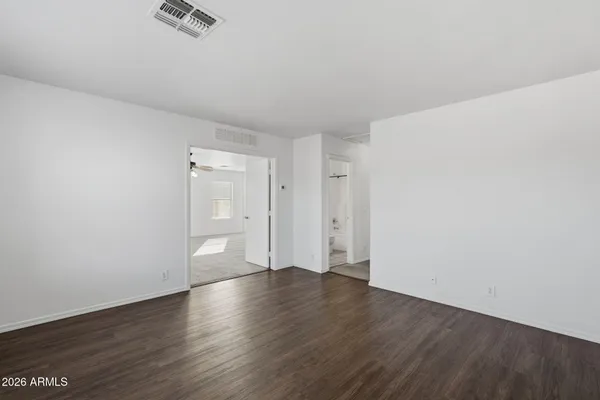 a view of an empty room with a window