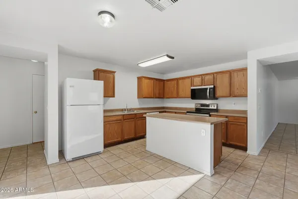 a view of a kitchen with a sink and a window