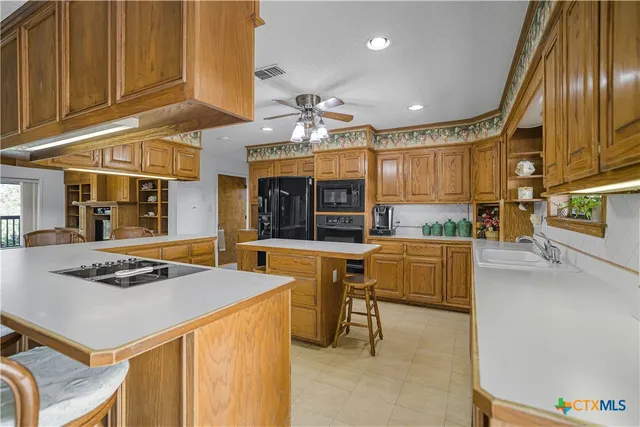 a kitchen with a sink and cabinets