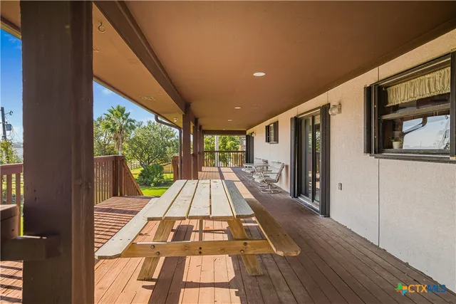 a view of balcony with wooden floor