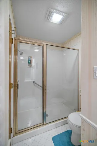 a spacious bathroom with a granite countertop sink and a mirror