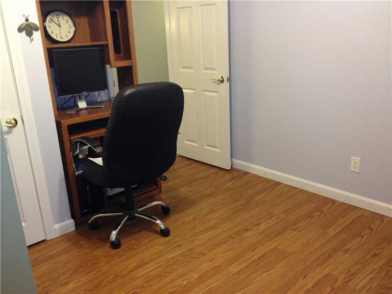 5 Heidi Road Lincoln, RI 02865 - Photo 13 of 25 Bedroom. One of four bedrooms. Laminate flooring. This room is currently being used as an office, There is also a bonus room downstairs which could be used as the office. So many possibilities with these rooms! This room measures 10 x 11.3.