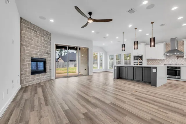 a view of kitchen with sink and wooden floor