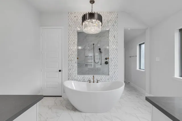 a spacious bathroom with sink and shower