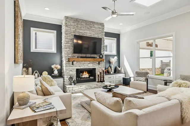 a kitchen that has a sink a stove and a wooden floor